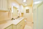 The half bath is easily accessible from the living room and provides an extra place to get ready for your evening out.